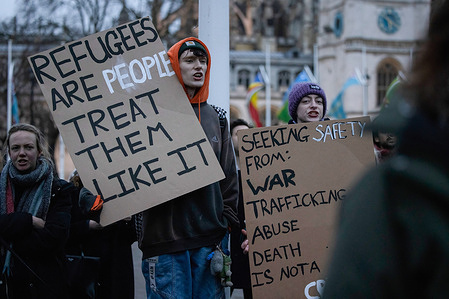 Protesters are seen holding placards expressing their opinion during the rally at Parliament Square. Several hundred protesters demonstrated outside the UK Parliament while the Illegal Migration Bill is going through its second reading in the House of Commons. The Illegal Migration Bill proposed by the UK Government has been criticized by some as a violation of human rights.