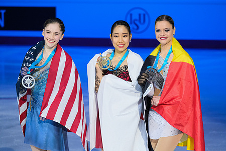 (L) Isabeau Levito of USA (Silver), (C) Mai Mihara of Japan (Gold) and (R) Loena Hendrickx of Belgium (Bronze) pose with their medals in the Senior Women during the ISU Grand Prix of Figure Skating Final Turin at Palavela.