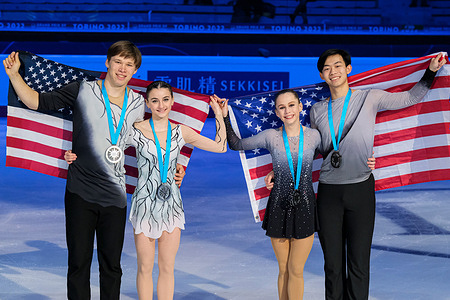 (L) Sophia Baram and Daniel Tioumentsev of USA (Silver) and (R) Cayla Smith and Andy Deng of USA (Bronze) pose with their medals in the Junior Pairs during the ISU Grand Prix of Figure Skating Final Turin at Palavela.