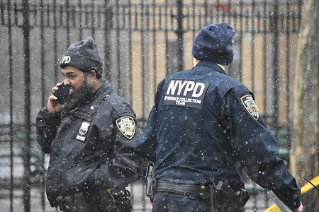 Police officers seen at the shooting crime scene. The New York City Police Department investigates a shooting in Manhattan of a 17-year-old male who was shot in broad daylight on E. 104 St., Madison Ave, and Park Ave. The 17-year-old victim was transported to hospital. The shooting happened outside Mae Grant Playground.