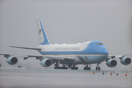 Air Force One with President Joe Biden aboard arrives in the rain at Los Angeles International Airport.