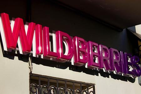 A Wildberries logo seen in one of the company's distribution centers in Moscow. Russian Media reports that employees of Russian e-commerce giant Wildberries throughout the country launched a protest against a new payment system introduced by the company. Wildberries reportedly ruled that employees were liable for the costs of any defective items that are returned or dispatched to the wrong buyer.