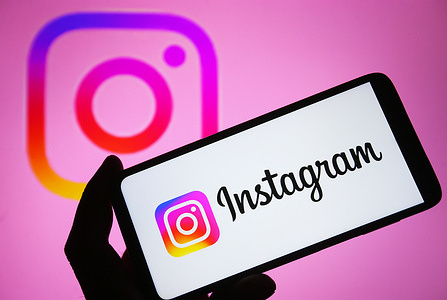In this photo illustration, Instagram logo is seen on a smartphone screen.