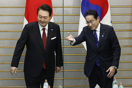 Yoon Suk Yeol, South Korea's president, left, is escorted by Fumio Kishida, Japan's prime minister, ahead of a summit meeting at the prime minister's official residence in Tokyo.