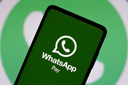 In this photo illustration the WhatsApp Pay logo seen displayed on a smartphone.