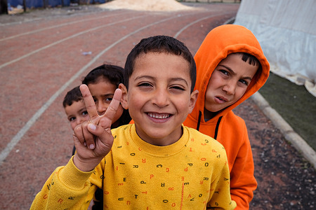 Children pose for a picture at the temporary shelter in Islahiye district. The epicenter of the quake, which measured 7.8 on the richter scale was just 37 kilometers west-north-west of Gaziantep, where those who have lost their homes are being housed in temporary shelters. As of 13 March 2023, more than 55,700 deaths had been confirmed: more than 48,400 in Turkey, and more than 7,200 in Syria.