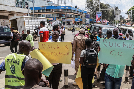 Protesters hold placards expressing their opinions during an anti-government demonstration called by Kenya’s opposition leader Raila Odinga. Kenya’s opposition leader, Raila Odinga, called for nationwide demonstrations against the high cost of living that has made life unbearable to many.