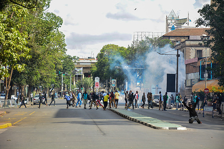 Teargas smoke engulfs protesters during a mass action organised by the opposition leader Raila Odinga to demand the government to lower the cost of living in the country.