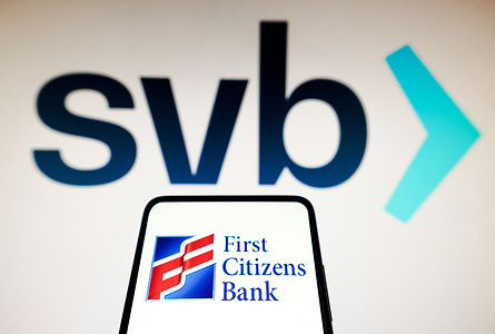 In this photo illustration the First Citizens Bank logo seen displayed on a smartphone and Silicon Valley Bank (SVB) logo on the background.