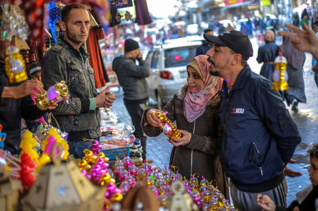 Palestinians buy decorations in preparation for the holy month of Ramadan in a market in Jabalia camp in the northern Gaza Strip. Muslims around the world will celebrate the holy month of Ramadan by praying and reciting the Quran as they fast from eating, drinking, smoking, and all sexual relations from dawn to dusk.