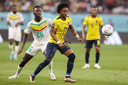 Pepe Gueye of Senegal (L) and Angelo Preciado of Ecuador (R) in action during the FIFA World Cup Qatar 2022 match between Ecuador and Senegal at Khalifa International Stadium. Final score; Ecuador 1:2 Senegal.
