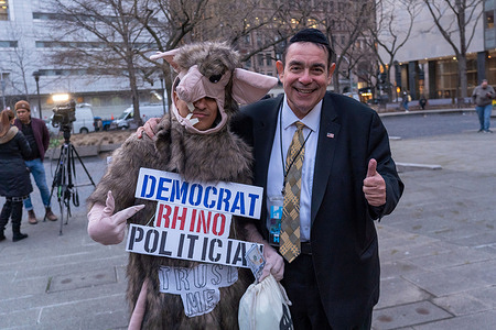 Heshy Tischler (R) poses with a President Trump's supporter dress as a rat at a rally, outside the court house, in support of former President Donald Trump amid his complex legal situation, which he has suggested could lead to his arrest on Tuesday on March 20, 2023 in New York City.