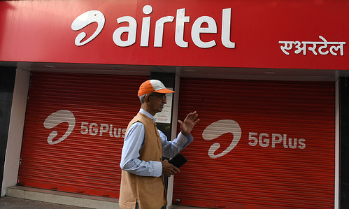 A man walks past the Airtel store in Mumbai. Airtel is offering unlimited data to its 5G customers in 26 cities. It will cover the entire country, rural and urban users by the end of March 2024.