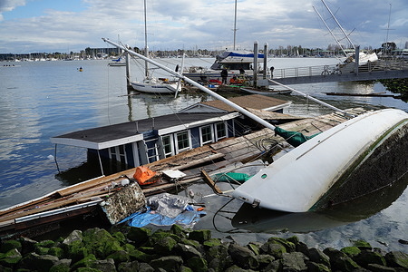 A boat and houseboat are seen submerged. A boat and houseboat parked at Jack London Aquatic Center in Oakland, California submerged during the strong storm of March 21. The storm came to San Francisco Bay Area on March 21 already made at least two people died and multiple cars damaged.