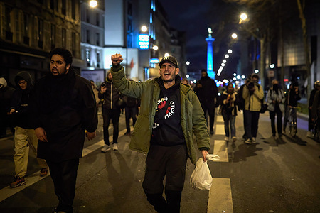 A demonstrator chants slogans while walking through the main streets of the French capital during the protest. A group of Parisians protested in the streets of the French capital after the reform of the retirement age.