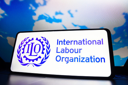 In this photo illustration, the International Labour Organization (ILO) logo seen displayed on a smartphone screen.