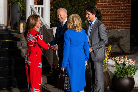 U.S. President Joe Biden (L2) shakes hands with Canadian First Lady Sophie Grégoire Trudeau (L) while Canadian Prime Minister Justin Trudeau (R) speaks with U.S. First Lady Jill Biden (C) during Biden's first official visit to the country since he became president, outside of Rideau Cottage in Ottawa. Though visits from American presidents to Canada typically take place soon after election, Biden's inaugural visit to the northern neighbour has been delayed due to COVID-19 travel restrictions.