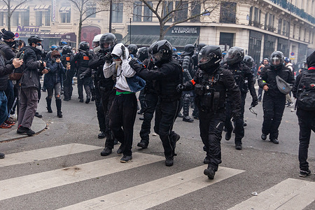 A protester is being arrested by police during the clashes. The ninth strike day against the new pension reform of Macron's government was marked by many clashes between the police and the protesters. After Elisabeth Borne invoked Article 49.3 of the French Constitution to force the new law, thousands of people took the streets of Paris again at a demonstration that began at Place de la Bastille.