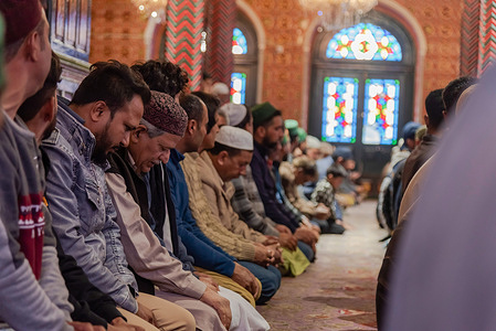 Kashmiri Muslims pray inside a shrine on the first Friday, second day of Islamic month Ramadan in Srinagar.