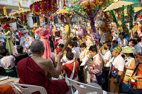 A Thai Buddhist monk splashes holy water on young ethnic Shan boys dressed in colorful costumes during the Poy Sang Long festival, a rite celebration of Buddhist novice ordination at Wat Ku Tao Temple. Poy Sang Long is a Buddhist novice ordination ceremony among the Shan people also called Tai Yai tribal in Myanmar and northern part of Thailand, but unlike any other ceremony of its type in the country. Young boys aged between seven and 14, known as the 'Crystal Sons' will be ordained as novices to learn the Buddhist doctrines to gain merit for their parents and families.
