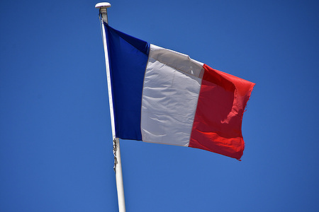 A France flag is seen flying atop the Courthouse.