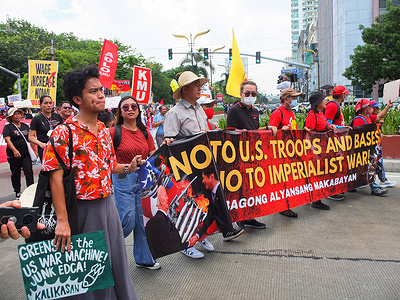 Protesters hold a banner during the demonstration. Progressive groups protested in front of the US Embassy to condemn the ongoing human rights violations caused by the EDCA (Enhanced Defense Cooperation Agreement), VFA (Visiting Forces Agreement), MDT (Mutual Defense Treaty), and other unequal agreements between the United States and the Philippines.