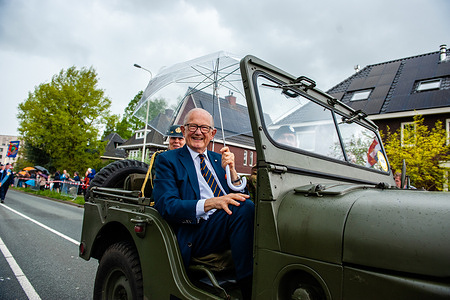 Pieter van Vollenhoven Jr., the husband of Princess Margriet of the Netherlands is seen holding an umbrella during the parade. Wageningen, also known as the 'City of Liberation', is especially connected to the remembrance days here on 4 and 5 May, as the capitulation which ended World War II in the Netherlands was signed in the city. During Liberation Day, The Liberation Parade, or 'Bevrijdingsdefilé' in Dutch is celebrated each year and reunites veterans and military successors to pay tribute to all those who gave their lives during WWII. This year also 17 British veterans were warmly welcomed, they arrived in British black cabs.