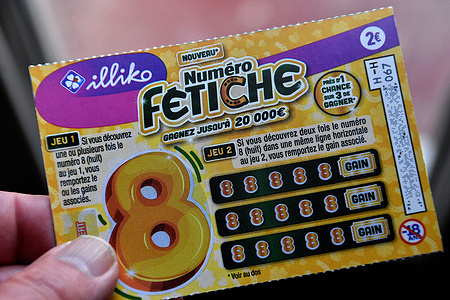 In this photo illustration, a Numéro Fétiche scratch game ticket seen displayed. Numéro Fétiche is a new scratch game proposed by Française des Jeux (FDJ). Sold for 2 euros, it can allow the luckiest to pocket a gain of up to €20,000.