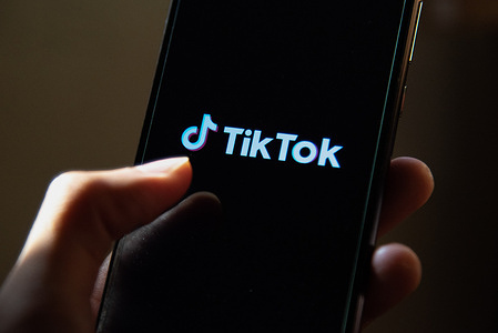 In this photo illustration, a TikTok App Logo seen displayed on a smartphone screen.