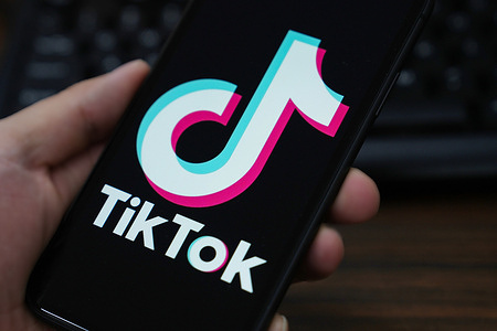 In this photo illustration, the TikTok logo is displayed on the screen of a smartphone.