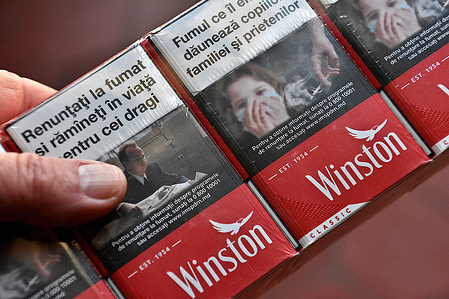 In this photo illustration, packs of smuggled Moldavian cigarettes seen displayed. The Ministry of Public Accounts has announced that the fight against tobacco smuggling in France has increased from 402 tons in 2021 to a new record with 649.07 tons of tobacco and cigarettes seized in 2022.