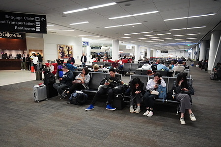 People seen waiting for a flight at the airport. San Francisco International Airport (SFO) is one of the busiest airport in the United States of America, thousands of travelers depart from this airport every day. The summer holiday usually begins in late May in America, and more travelers depart from here than usual.