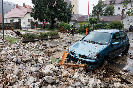 A car is seen parked among the rubble of a wall that was torn down by high water in Begunje. Heavy continuous torrential rain and storms have caused major flooding throughout Slovenia. Roads and railroads were closed, several areas had no electricity or drinking water, and fatalities were reported.