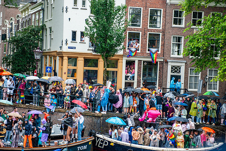 Thousands of people are seen gathering around the canal to celebrate parties during the event. The Canal Parade starts around noon and takes all afternoon. Around 80 boats of different organisations and non-profit organisations participate in the event. The Canal Parade is what Amsterdam Gay Pride is famous for. It's the crown of their two weeks long festival that features more than 200 events. The boats start at the Scheepvaart museum in the eastern part of the city center moving towards the Amstel River.