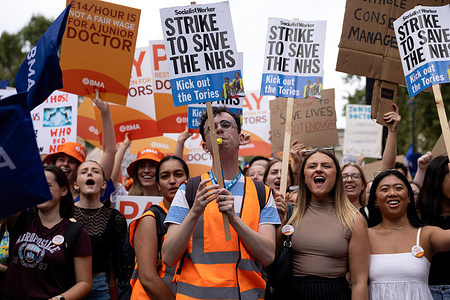 A crowd of Junior doctors holding placards expressing their opinion during a strike action outside Downing Street. Junior doctor members from the British Medical Association (BMA) continue to take a 96-hour walkout monthly due to disputes over pay and working conditions with the UK Government. The strikes affected thousands of hospital appointments and elective surgeries. The strike started from 7 a.m. on 11th August to 7 a.m. on 15th August 2023.