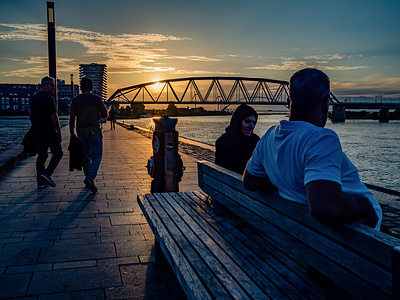 A couple is seen resting on a bench while watching the sunset beside the Waal river in Nijmegen. After several changeable weeks, the Netherlands can look forward to summer weather starting this week. Temperatures have risen with plenty of room for sunshine. In the following days, it will remain mostly dry and the sun will shine extensively so that temperatures between 22 and 28 degrees can be expected.