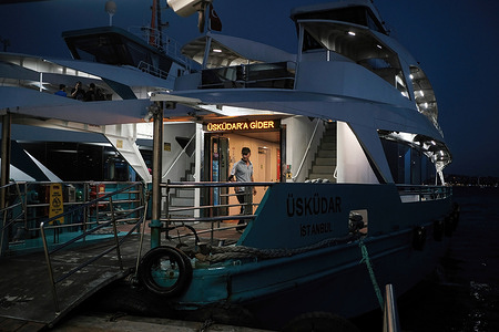 An officer seen preparing a Ferry for the voyage at the Besiktas pier. Beşiktaş Pier is a place where people used to board a ferry from the Beşiktaş district on the European side to the Üsküdar district on the Asian side.