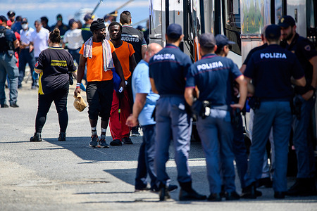Migrants are seen moving toward the bus after disembarking from the Ocean Viking. Ocean Viking, the rescue vessel of the NGO SOS Méditerranée, disembarked 186 migrants in the port of Vibo Valentia, they were from the 439 rescued in multiple operations in international waters near Lampedusa. The remaining Migrants will be disembarked in the port of Naples on 28 August 2023.