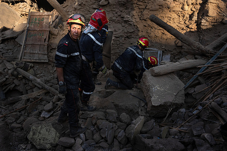 Moroccan firemen work to remove the bodies of people who were crushed to death when a cafe collapsed during the earthquake in Amizmiz. The earthquake in Morocco on 8 September was the deadliest in the country's history, leaving more than 2,000 people dead.