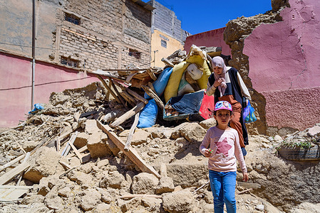 A mother and her daughter leave their destroyed house following the earthquake in Azizmiz. The 6.8 magnitude earthquake hit on 8th September, 70 km south of Marrakesh. It was one of the strongest and deadliest in Morocco's history, with a death toll of more than 2,000 people and thousands injured.