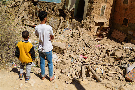 Children seen standing in front of the remains of a destroyed house where a mother and her 3 children lost their lives due to the earthquake. Small farmers' villages in the outskirts of Marrakesh have been the worst affected by the magnitude 6.8 earthquake that hit Morocco. The arrival of the aid in the area has been slow considering their remote location and road damages.