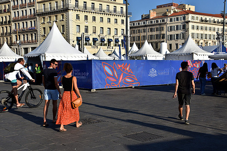 People walk near the Rugby World Cup Village in Marseille. Rugby World Cup Village in Marseille, France.