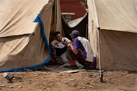 A man smiles as they converse at a refugee camp in the town of Amizmiz. The earthquake in Morocco on Friday 8 September was the worst in the country's history, leaving more than 3,000 people dead.