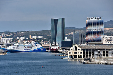 View of the Port of Marseille-Fos, the CMA-CGM tower (C) and the La Marseillaise tower (R). Views of Marseille, France.