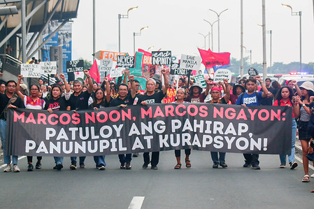 Human rights advocates holds a banner while marching on the street of Manila during the demonstration. Protesters marched in Manila to mark the 51st anniversary of the declaration of Martial Law in the Philippines by the late dictator Former President Ferdinand Marcos. Martial Law lasted from 1972 to 1981, during which time Marcos cracked down on dissent and imprisoned and killed thousands of opponents. He is accused of using his power to amass a huge personal fortune.
