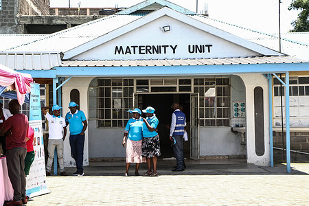 People stand in front of a maternity unit during the national celebrations of The World Contraception Day. According to data from Kenya Demographic and Health Survey (KDHS), Kenya has made significant progress in promoting access to family planning and increasing the contraceptive prevalence rate from 53% in 2014 to 57% in 2022, with unmet need for family planning reducing slightly from 18% to 14% while teenage pregnancy has fallen from 18% to 15%.