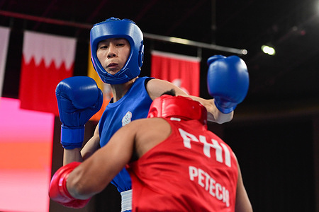 Nesthy Petecio (R) of the Philippines and Lin Yu Ting (L) of Chinese Taipei compete during the Asian Games 2023, Women's Boxing 54-57Kg Preliminaries Round of 16 match at Hangzhou Gymnasium. Final score; Lin 4:1 Petecio.