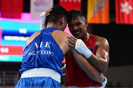 Eumir Felix Marcial (R) of the Philippines and Manh Cuong Nguyen (L) of Vietnam are seen in action during the 19th Asian Games men's boxing 71-80Kg preliminary R16 match held at the Hangzhou Gymnasium. 
Final score Marcial 5:0 Nguyen.
