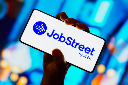 In this photo illustration, the JobStreet logo is displayed on a smartphone screen.