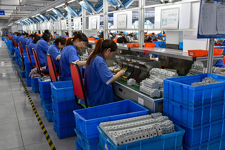 Women wearing blue overalls work on the production line of Anhui Wangu Lian Electric Co., LTD factory that produces a circuit breaker. China's gross domestic product grew by 4.9 percent year-on-year in the third quarter after a 6.3 percent rise in the second quarter, posting a steady recovery despite downward pressures, the National Bureau of Statistics said on Wednesday. In the first three quarters, China's GDP grew by 5.2 percent to 91.3 trillion yuan ($12.5 trillion) after a 5.5 percent growth in the first half of the year, the bureau said.